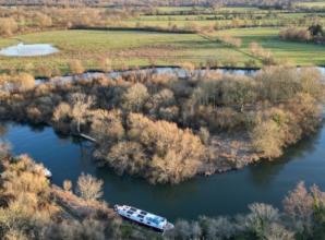 Heavily wooded island in Thames sold at auction for almost &pound;100,000