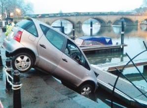 Elderly woman rescued after accidentally driving into river