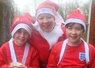 Storming Santas defy strong winds for running fundraiser