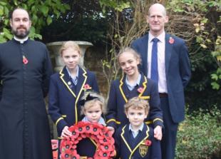 Children taught lesson in forgiveness as they pay tribute with poems and wreaths