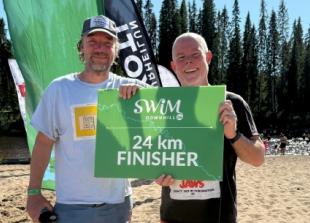 Pair complete Arctic river swim