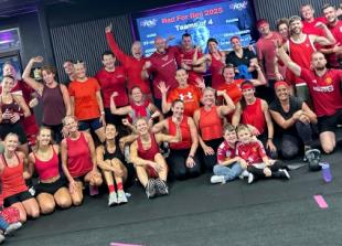 Gym members wear red for boy with muscle wasting disease