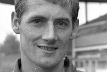 Woman knitting for charity in memory of footballer