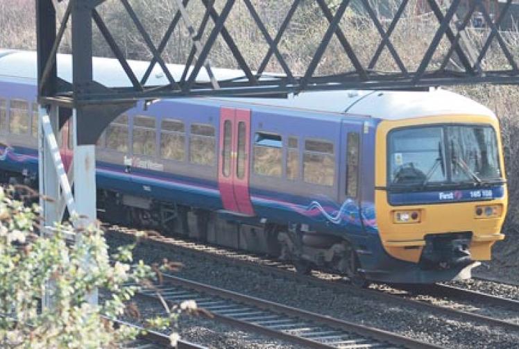 Rail service cuts plan criticised by Theresa May MP