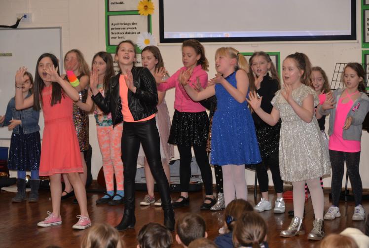 Schoolchildren sing Sixties hits for music competition