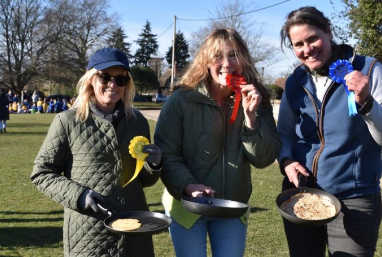 Pancake race returns in sunshine