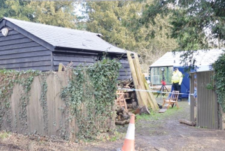 A policeman guards the site in Gravel Hill