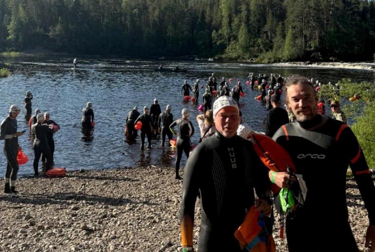 Pair complete Arctic river swim