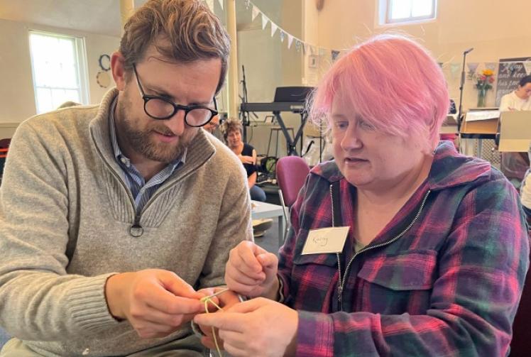 MP (and family) in knitting workshop at cafe
