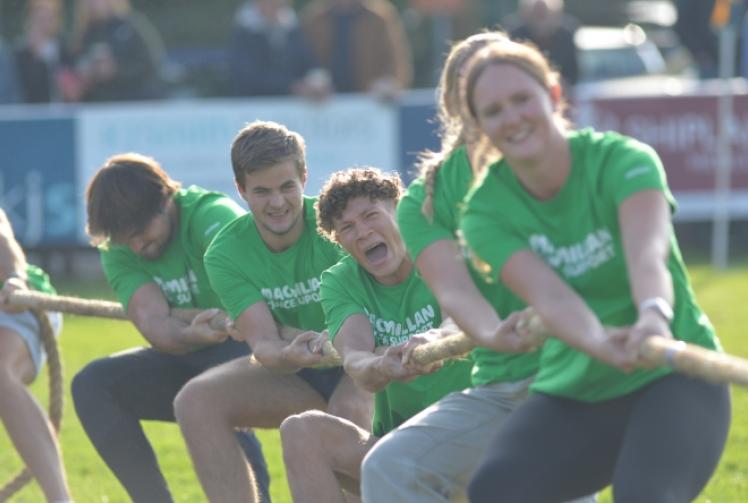 Athletes do battle in tug of war for cancer charity